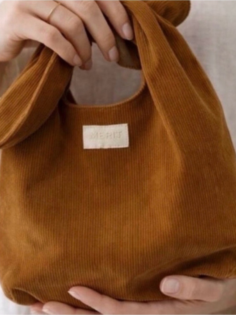 Merit Knot-Handle Cosmetic Bag in Camel
